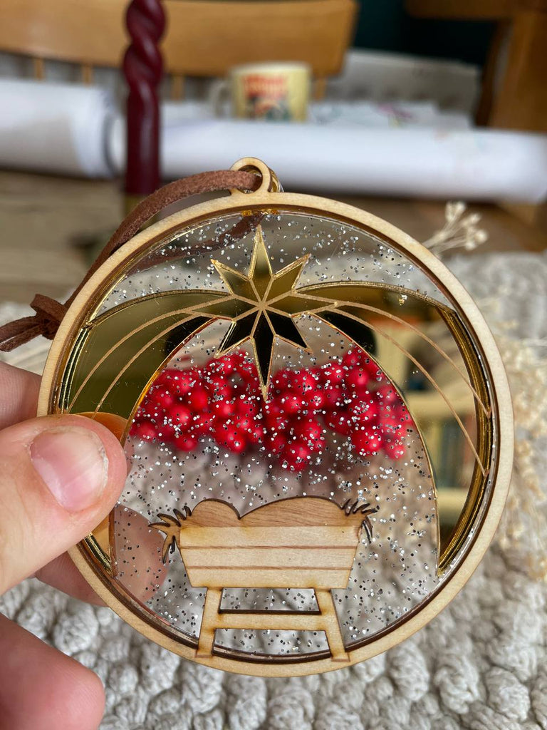 Manger golden star christmas ornament