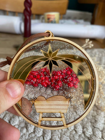 Manger golden star christmas ornament
