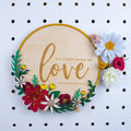 Do everything in love floral wall sign